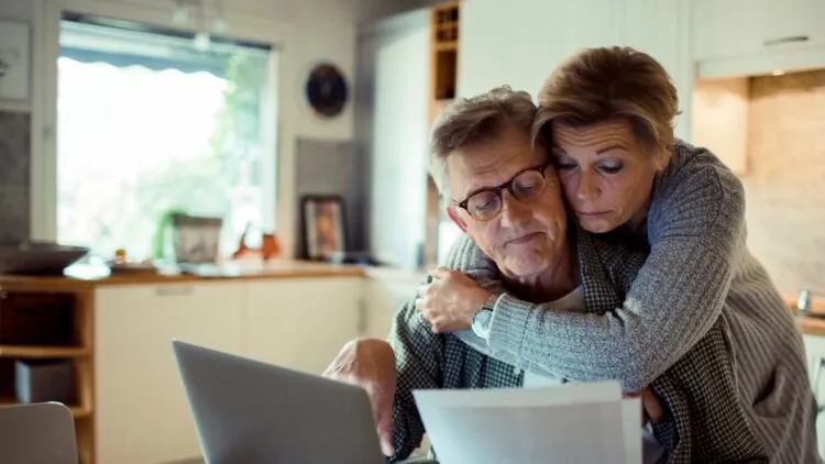 Older Couple looking at bills